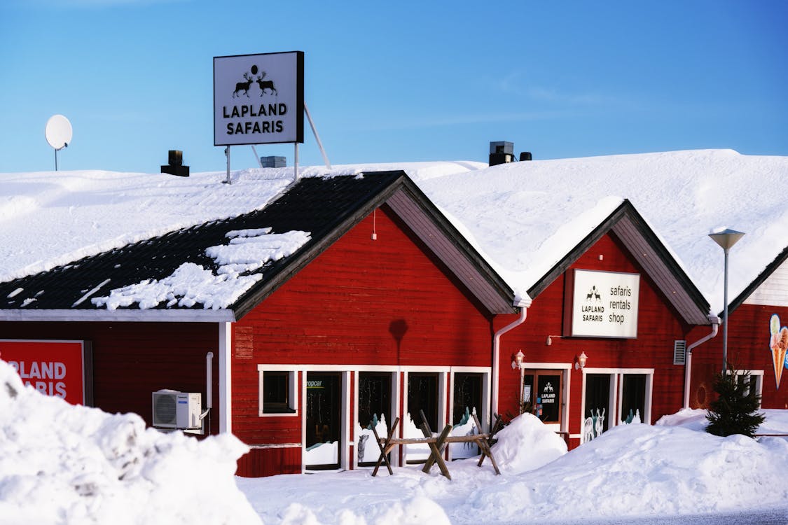 Free Red Wooden Buildings of a Travel Agency in Lapland Stock Photo
