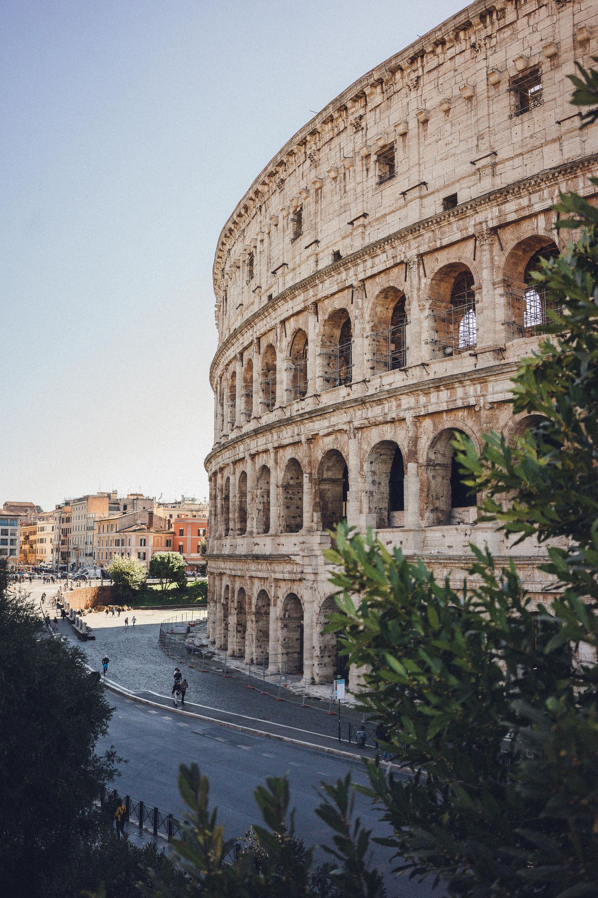 Colosseum exterior in Rome under a clear sky
