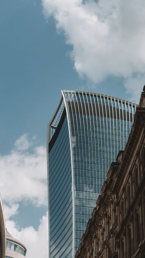 Free Vertical shot of the iconic Walkie Talkie building in London's cityscape under blue skies. Stock Photo