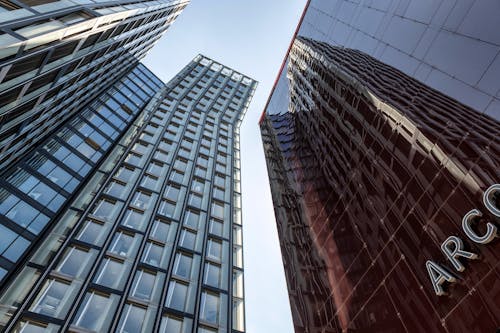 Free Low Angle Shot of Modern Office Skyscrapers  Stock Photo