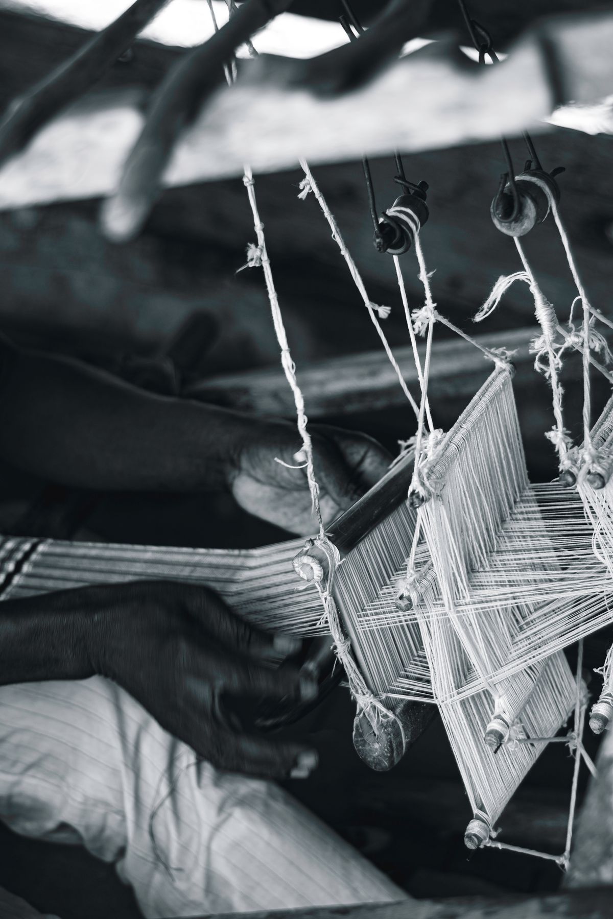 Artisan weaving silk on a traditional loom