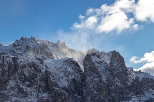 Free Breathtaking view of snow-capped rocky mountain peaks against a bright blue sky. Stock Photo