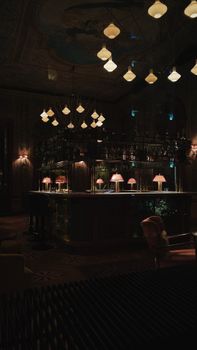 Classic bar interior in İstanbul with warm ambient lighting and vintage decor.