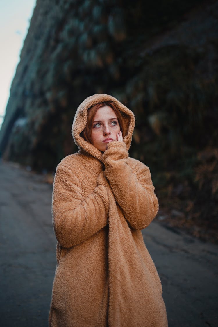 A Woman Standing Outdoors 