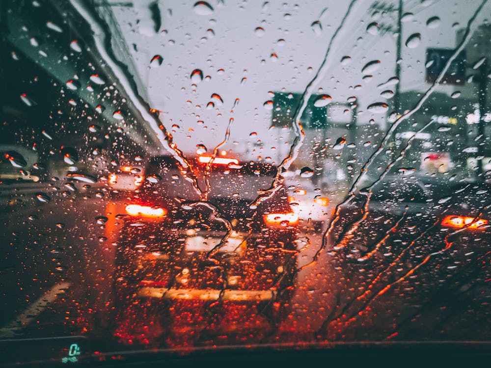 rain running down the windshield of a car