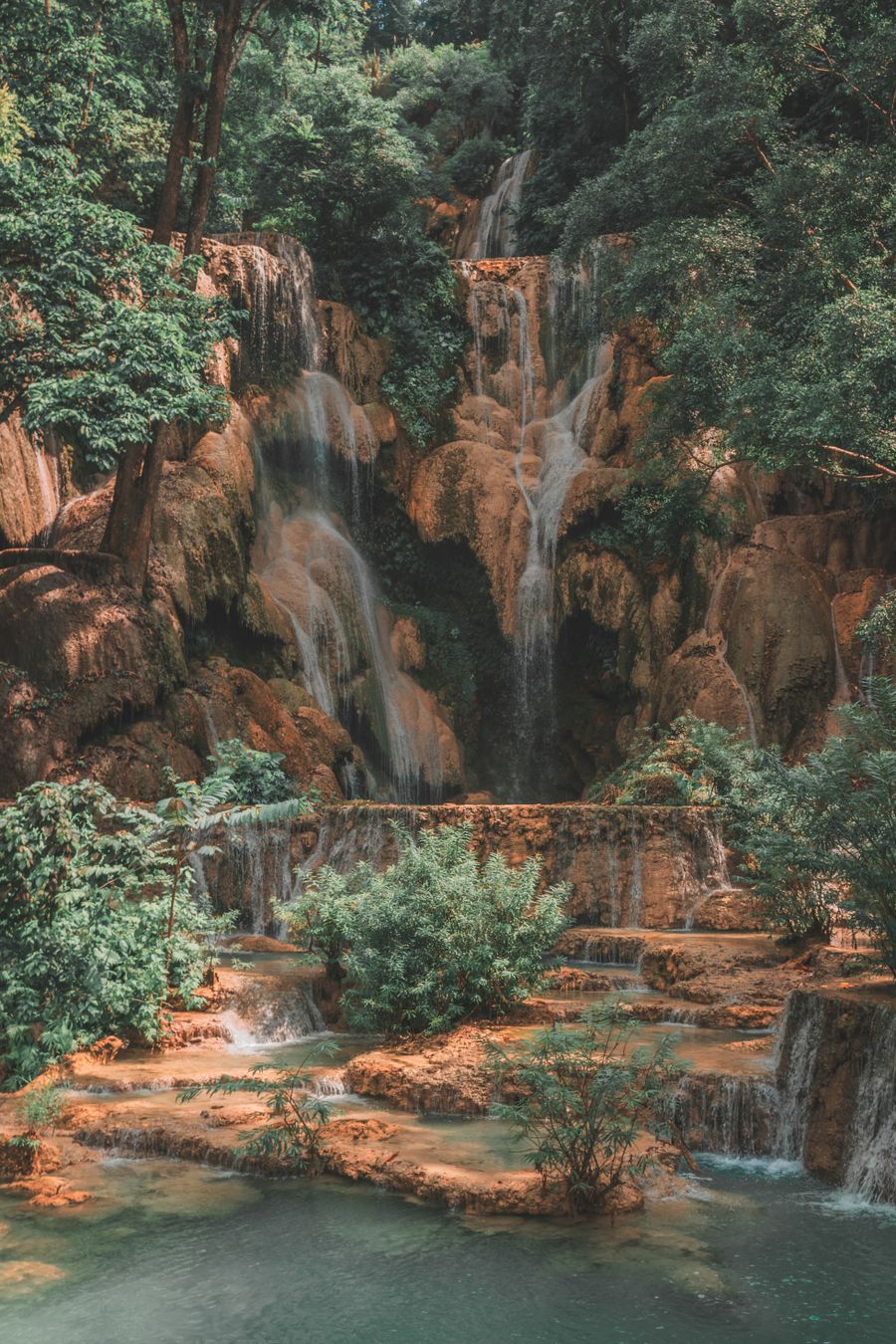 Kuang Si waterfall cascading through forest, Laos