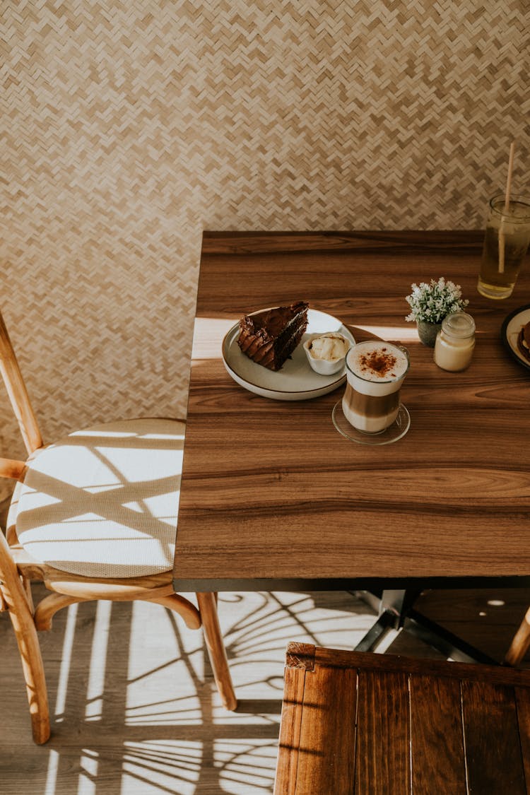 Cake On Plate And Coffee In Glass On Table