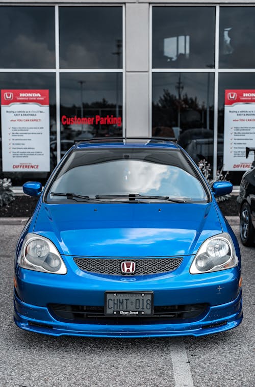 Blue Honda Civic on Parking Lot of Car Dealer