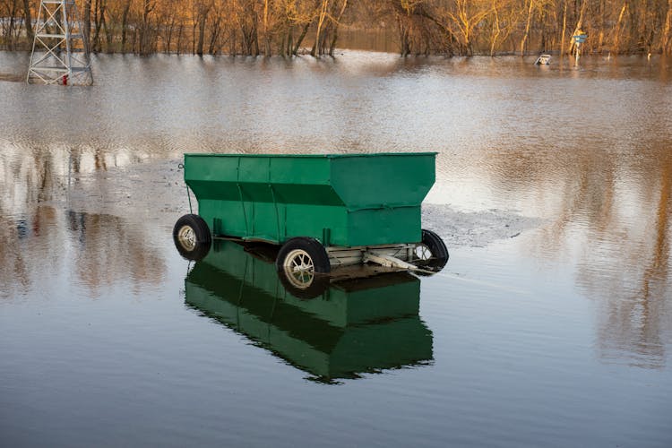 Trailer On Ice And Sunken In Water