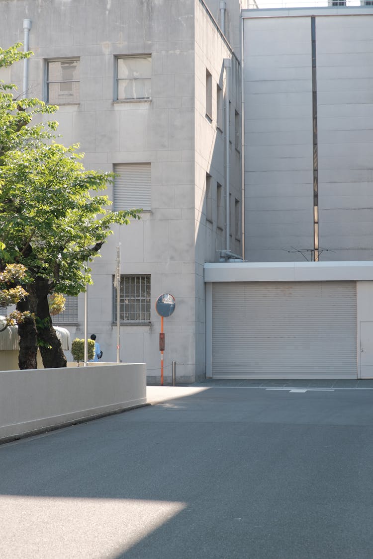 White Building Walls Behind Street