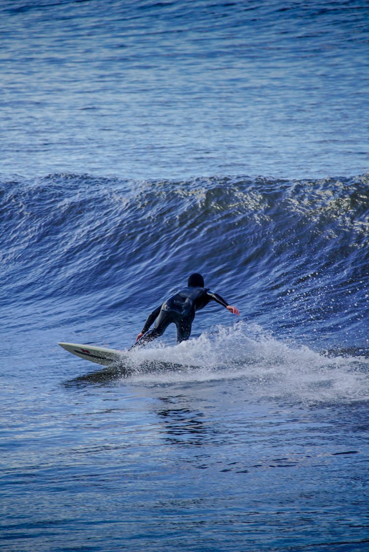 Surfer Surfing On Wave