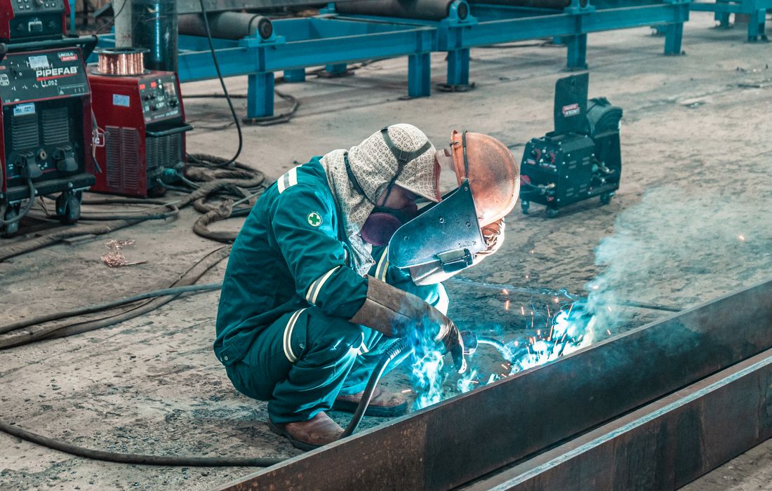 Welder fabricating steel
