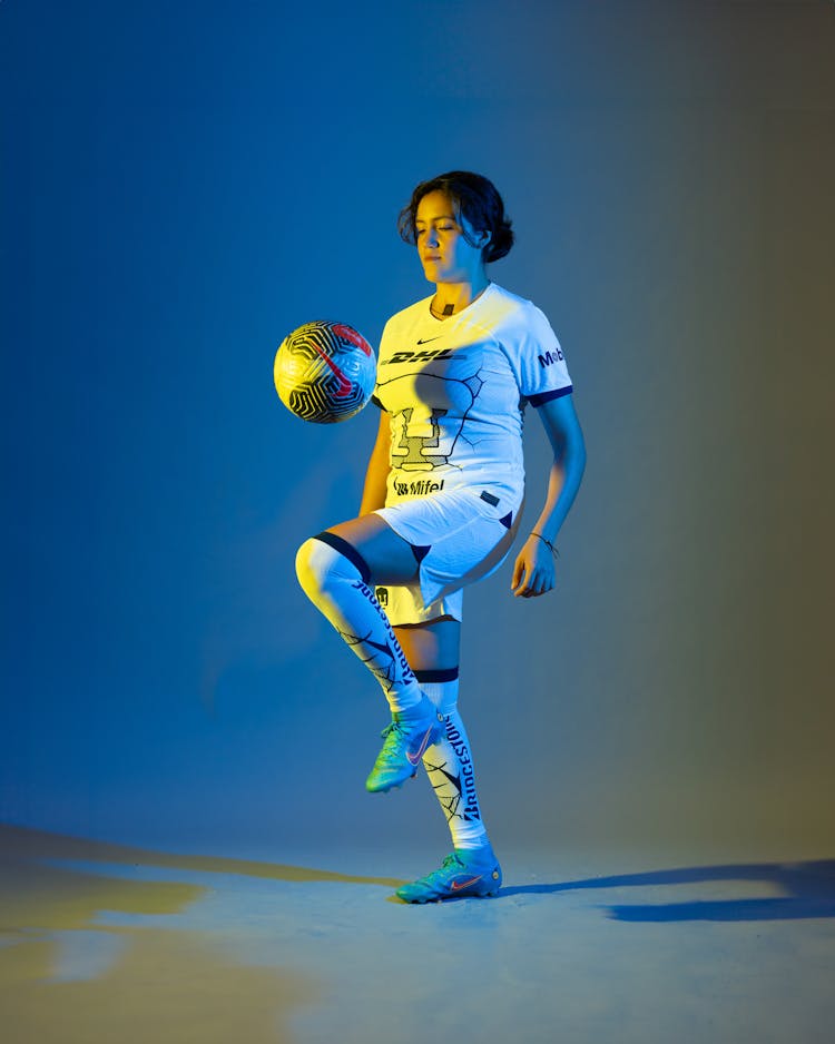 A Soccer Player With A Ball