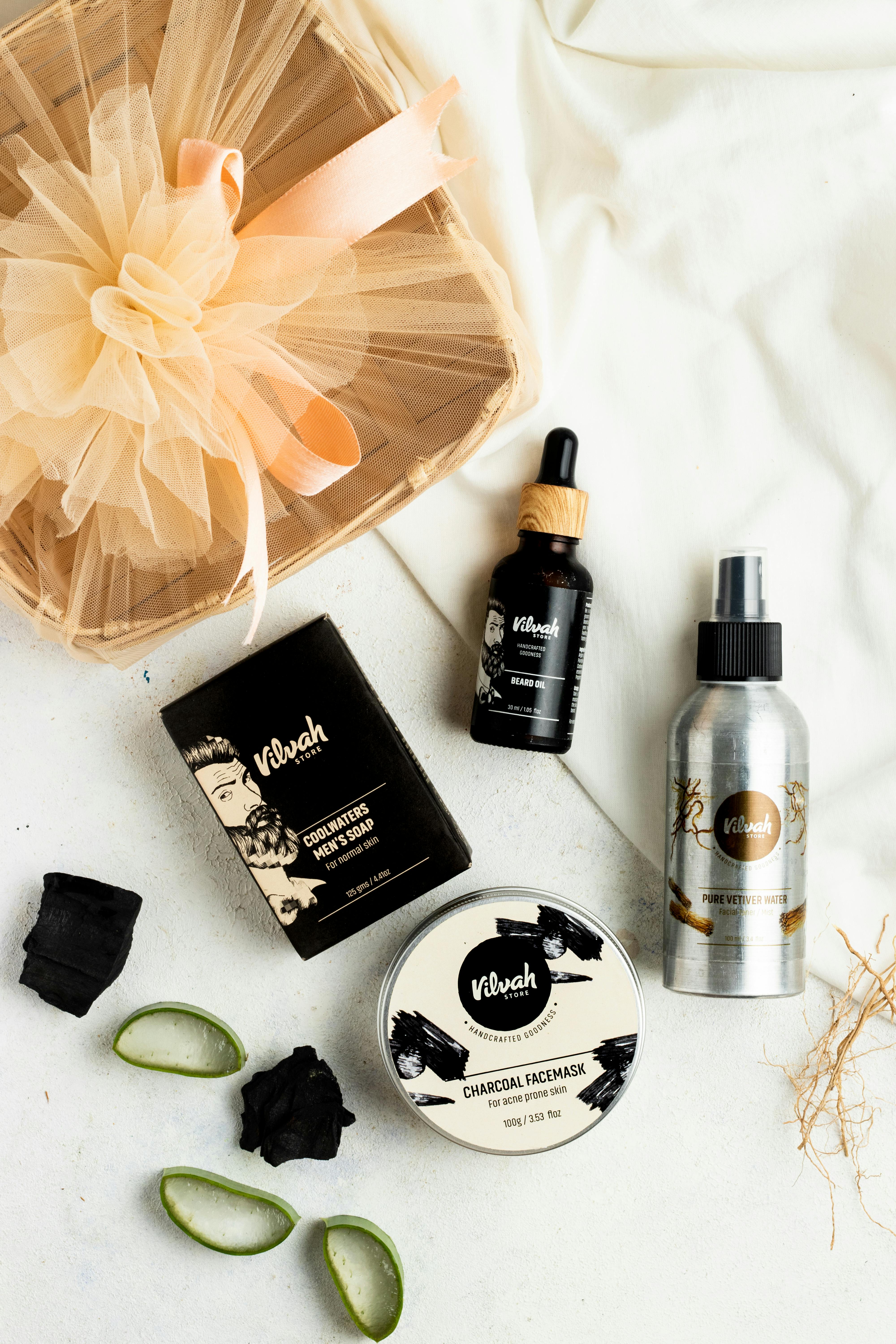 Discover a flat lay of luxury skincare products featuring aloe vera and charcoal for rejuvenating care.