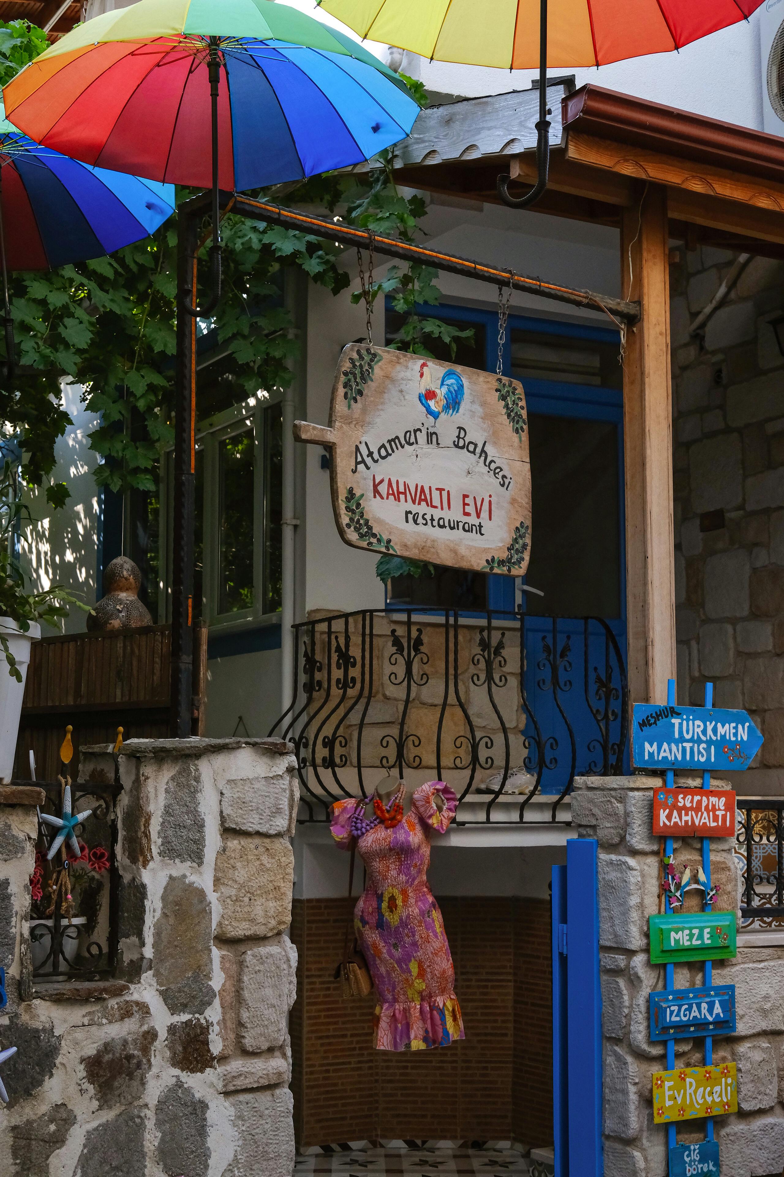 a colorful umbrella is hanging from a building