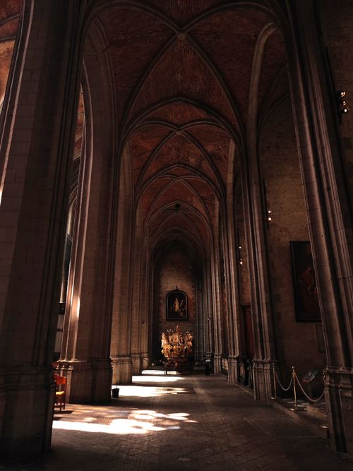 Free Arched interiors of a Gothic cathedral in Mons, Belgium, showcasing intricate designs. Stock Photo