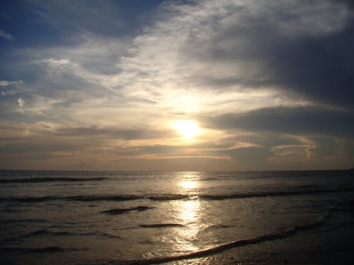 Gratis stockfoto met oceaan, strand, zonsondergang