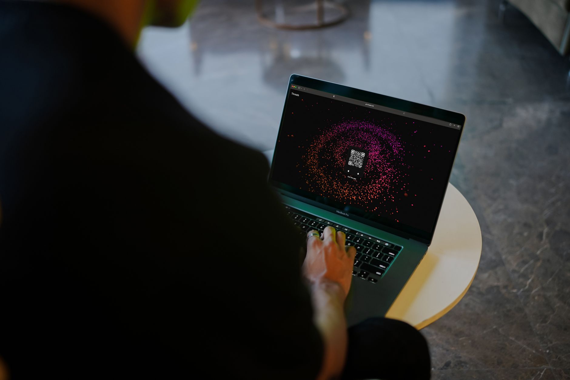 A person designing a fantasy world on a computer with a large screen