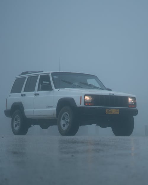 White 4x4 Car in Rain