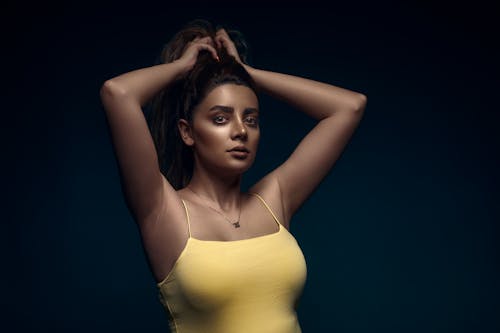 Brunette Woman Fixing Hair