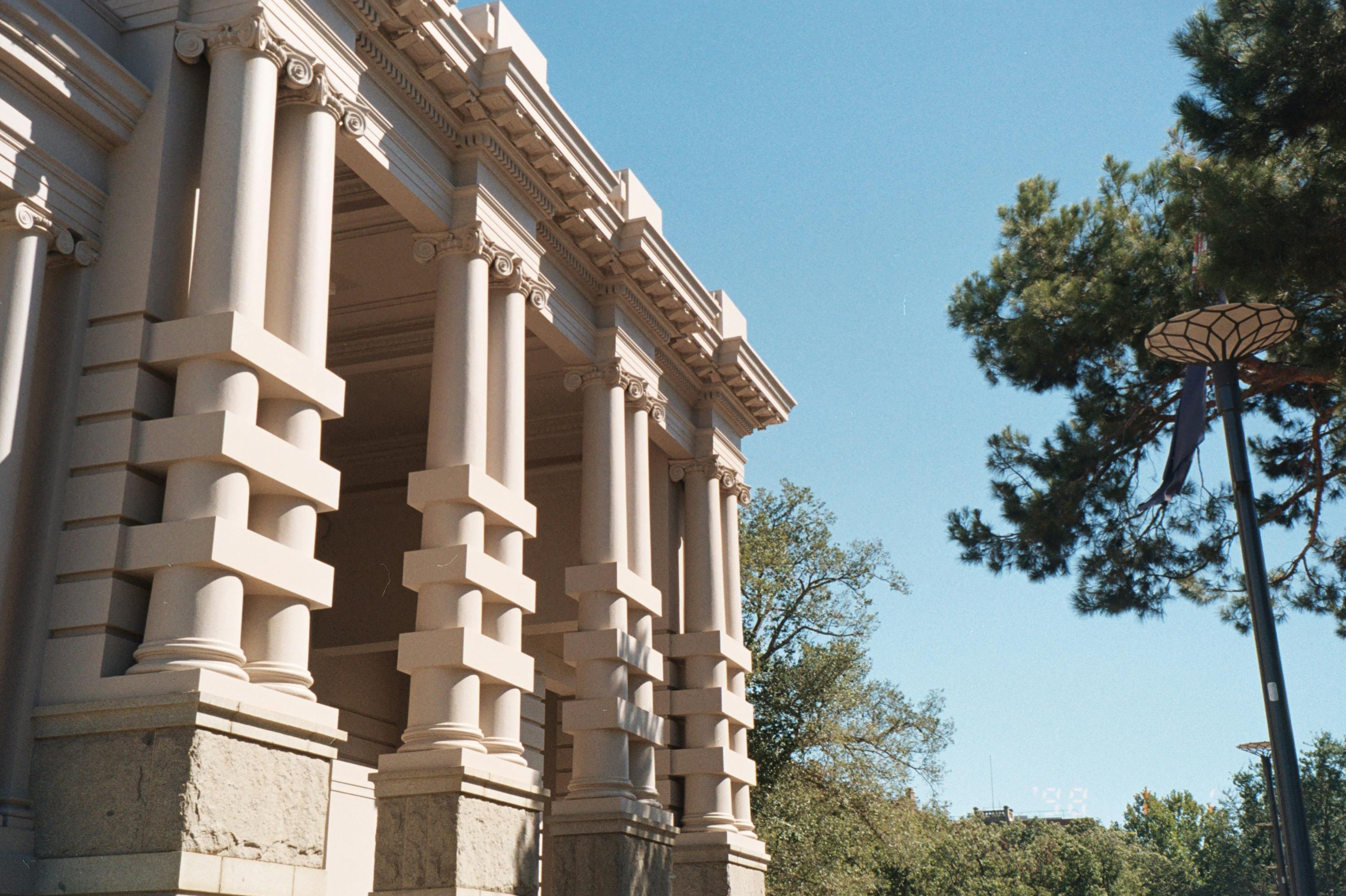 Stunning neoclassical architecture of Peace Memorial Hall in Geelong, Australia under clear blue skies.