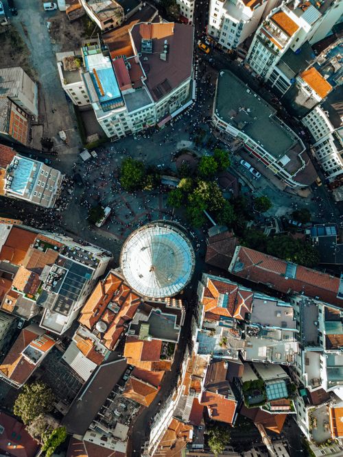 Free A breathtaking aerial shot of Galata Tower surrounded by Istanbul's vibrant cityscape. Stock Photo