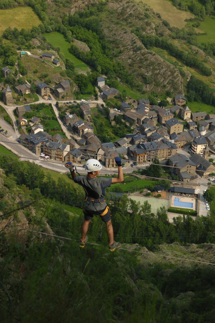 Man Climbing On Rope