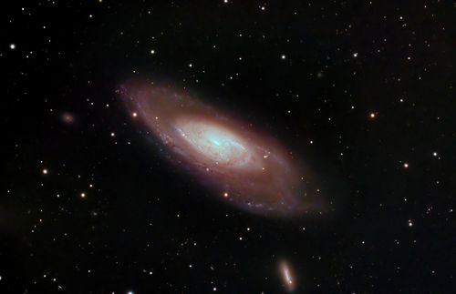 Free A captivating image of a spiral galaxy surrounded by stars in deep space, showcasing cosmic beauty. Stock Photo