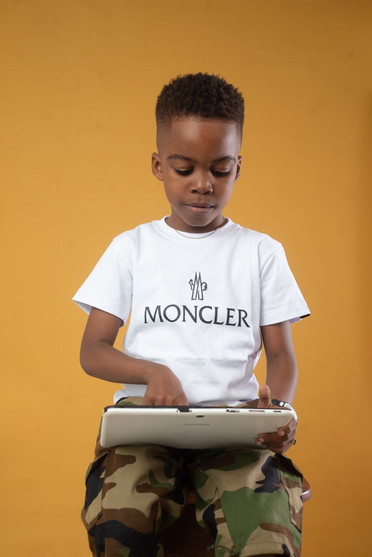 Boy Touching Tablet Screen