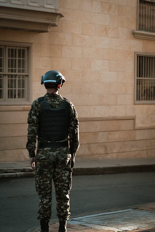 A Soldier Standing in a City