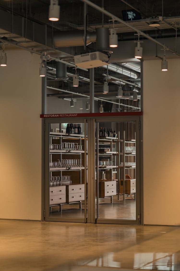 Shelves Behind A Glass Door In A Restaurant