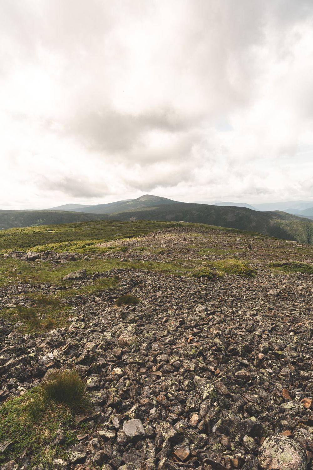 A rocky mountain with a view of the sky · Free Stock Photo