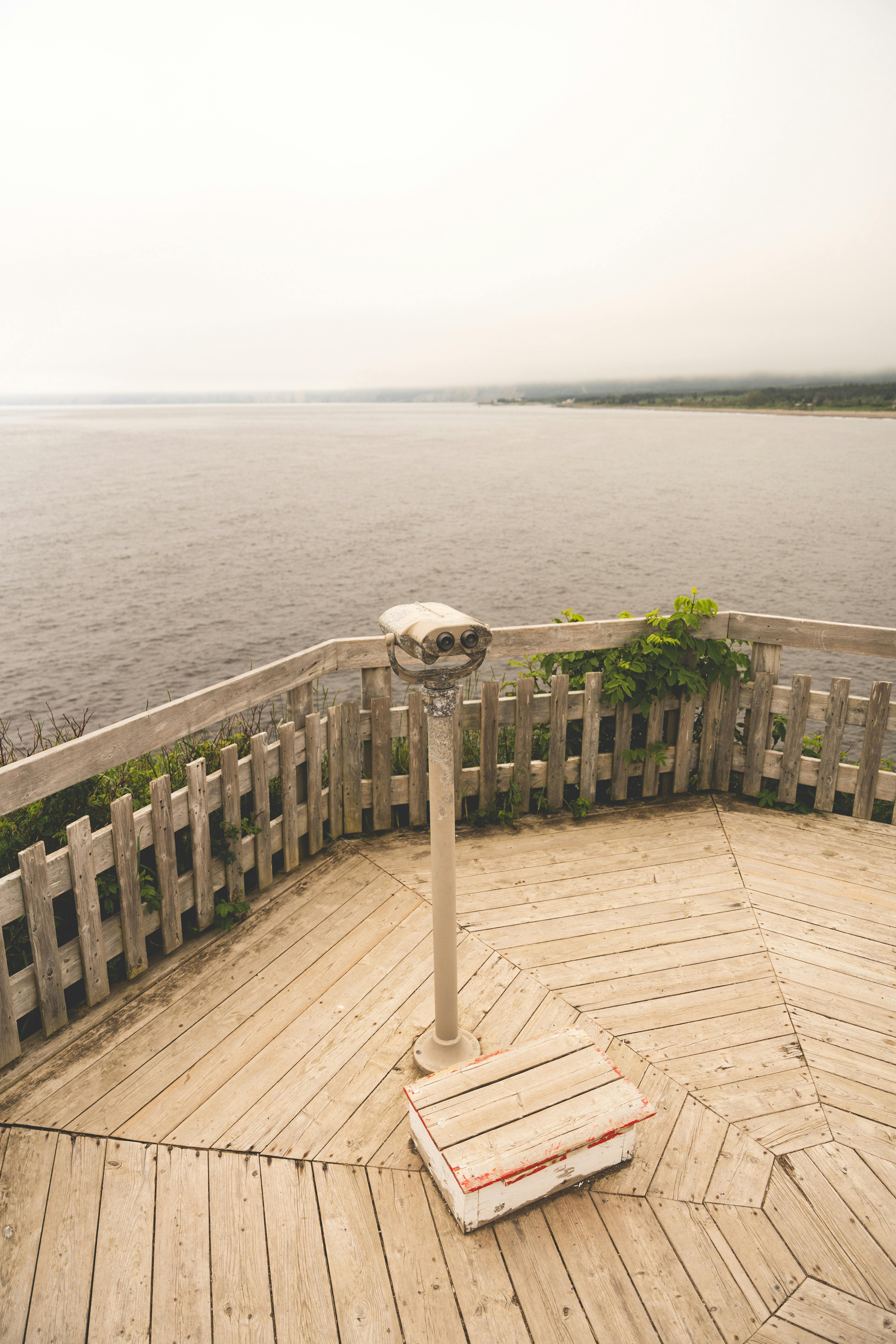 a view of the ocean from a deck