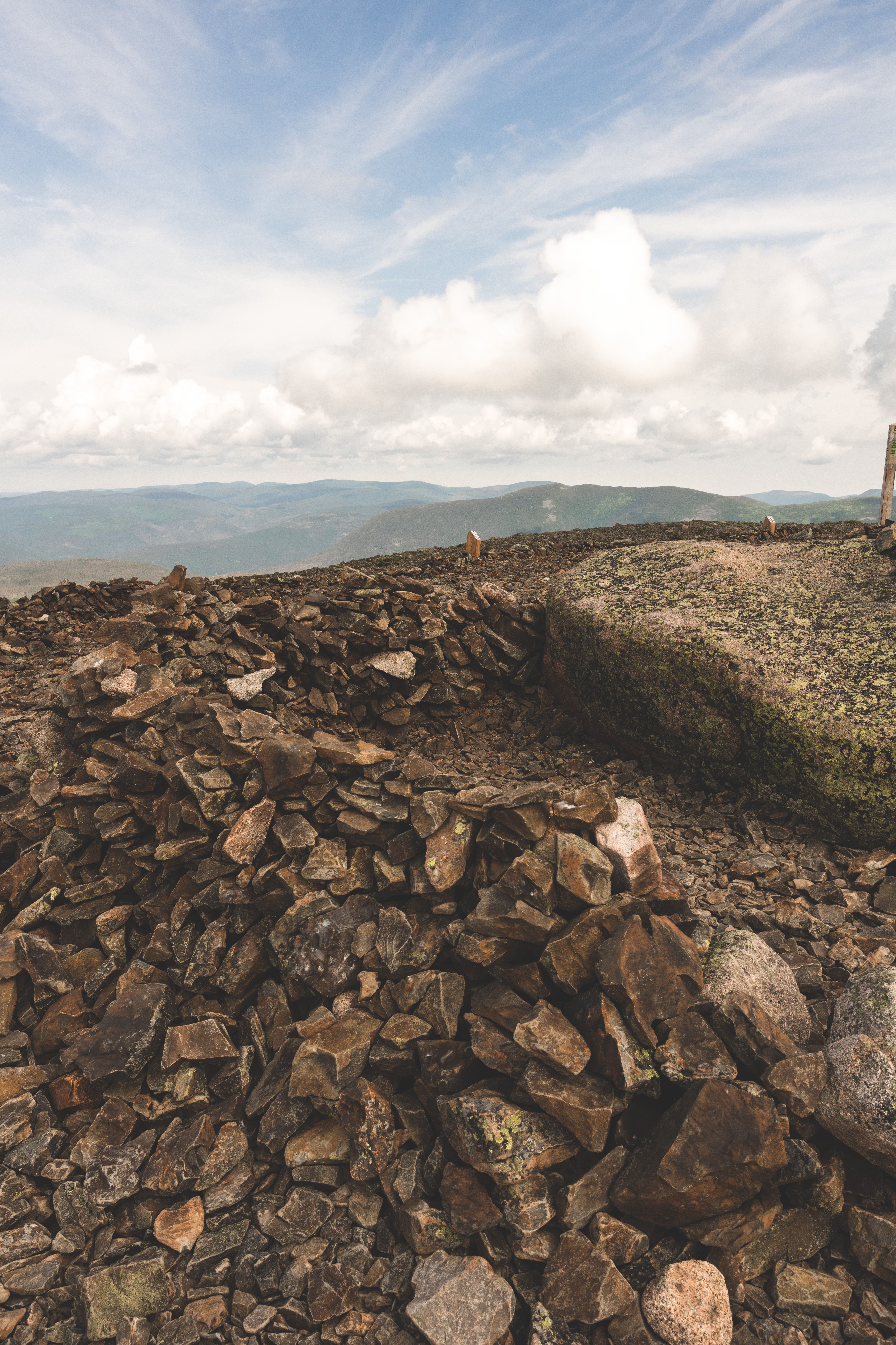 A pile of rocks on top of a mountain · Free Stock Photo