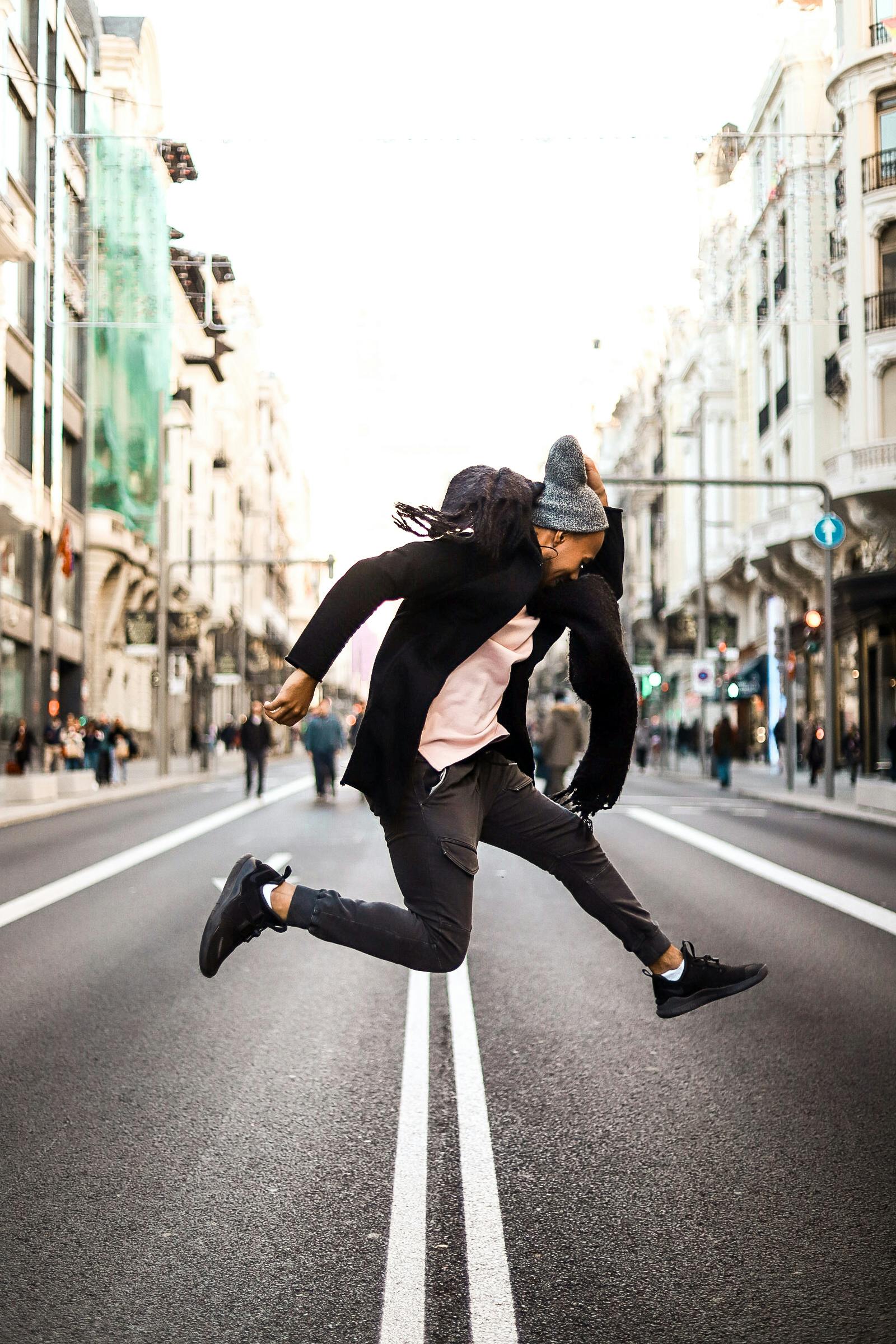 a man jumping on the road