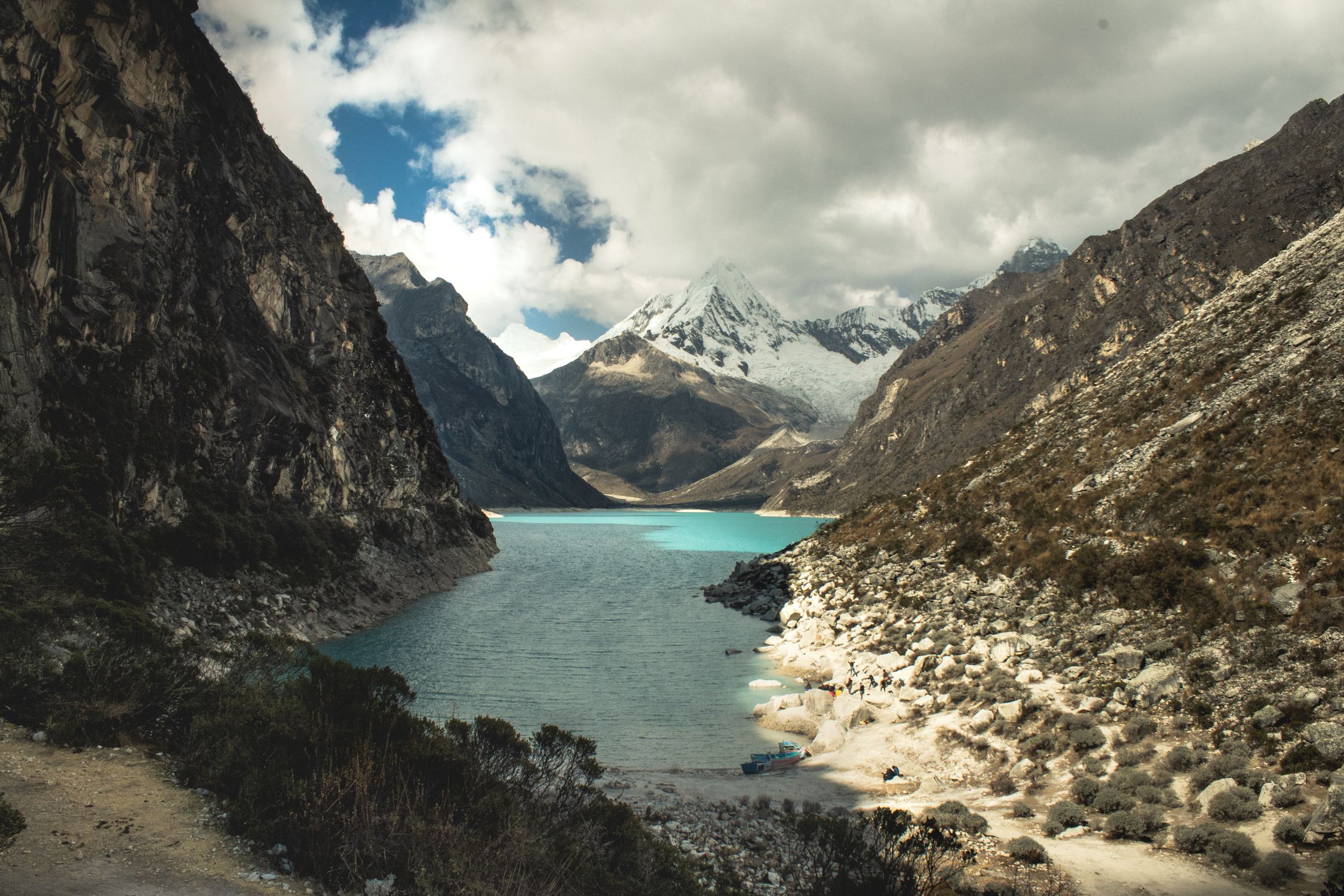 Beautiful landscape of turquoise lake surrounded by the Andes mountains in Huaraz, Peru.