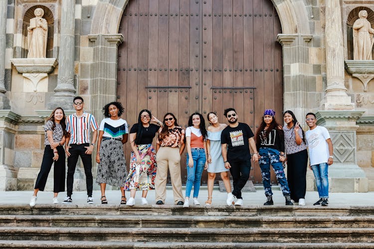 Group Of Young People Posing On The Church Steps