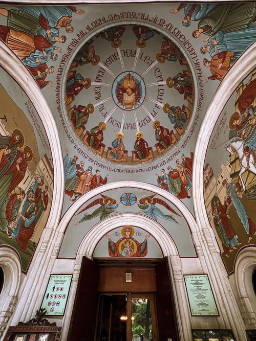 Free Beautifully decorated interior dome of Kashveti Church in Tbilisi, showcasing religious artwork and architectural elegance. Stock Photo