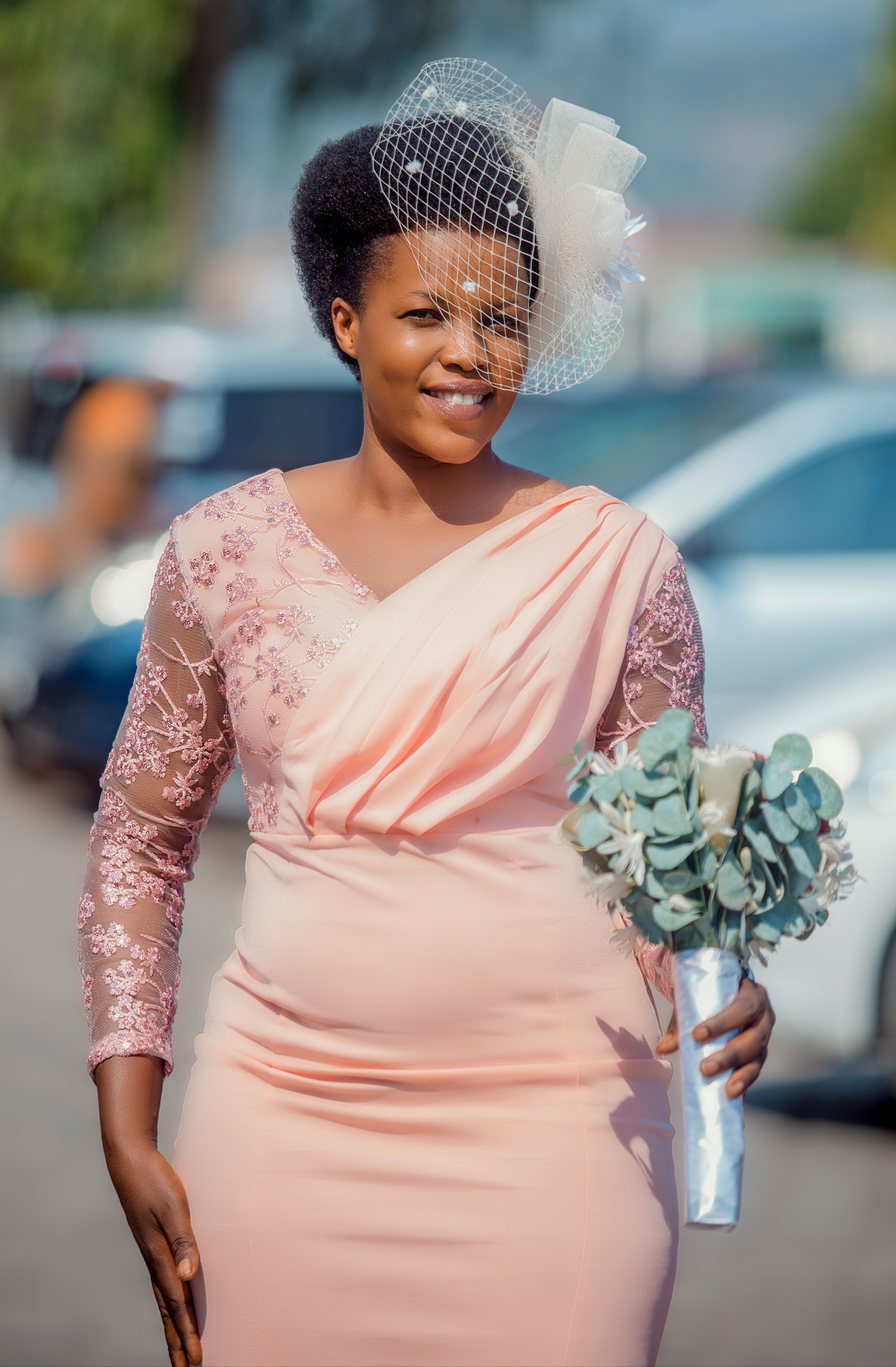 Elegant Woman in a Pink Dress Holding a Bouquet · Free Stock Photo