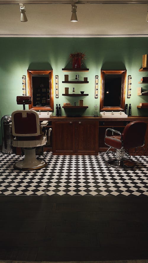 Interior of a Barber Shop with Vintage Leather Chairs and Checkered Floor 
