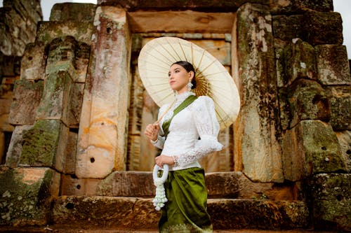 Woman in Traditional Clothing and with Umbrella