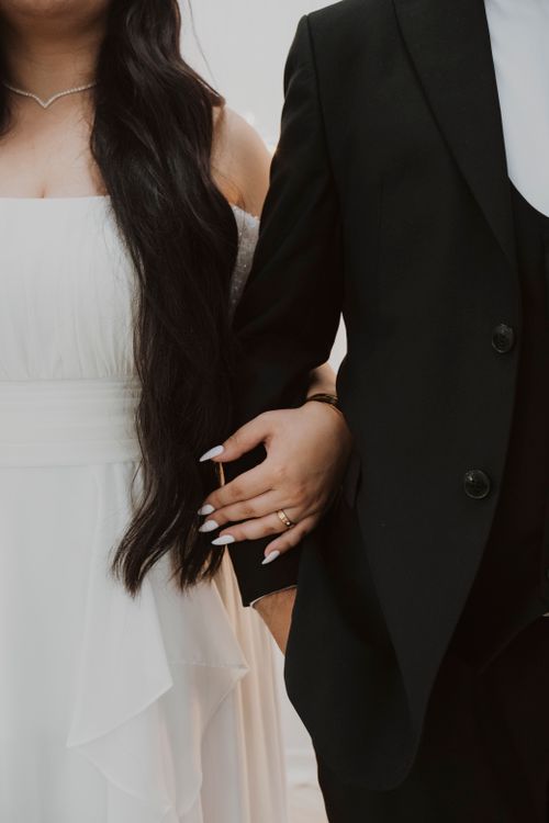 Free Close-up of a bride and groom in elegant wedding attire, symbolizing love and togetherness. Stock Photo