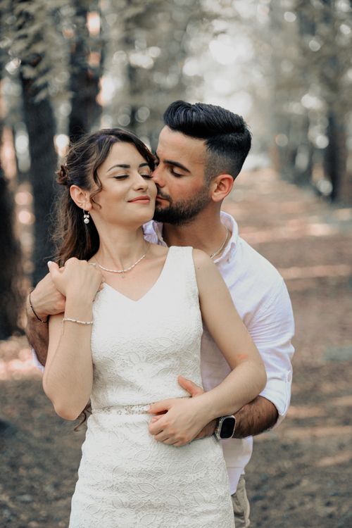 Free Portrait of a couple embracing in a serene outdoor setting in Fethiye, conveying love and romance. Stock Photo
