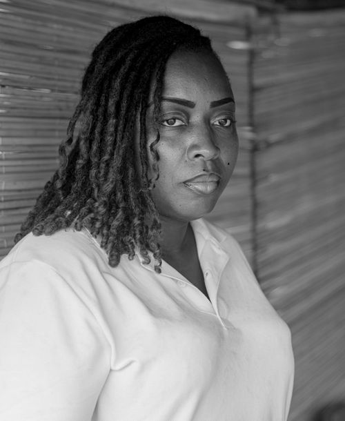 Free Striking black and white portrait of a serious woman with locs, exuding strength and poise. Stock Photo