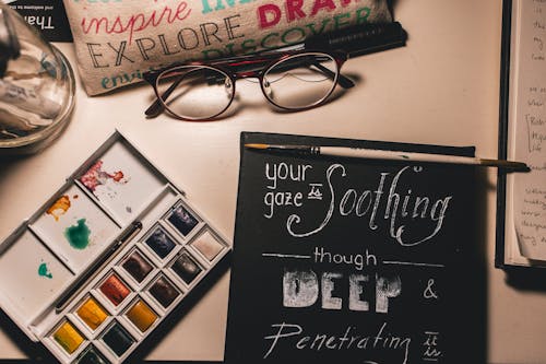 Rectangular White Color Painting Palette Beside Eyeglasses