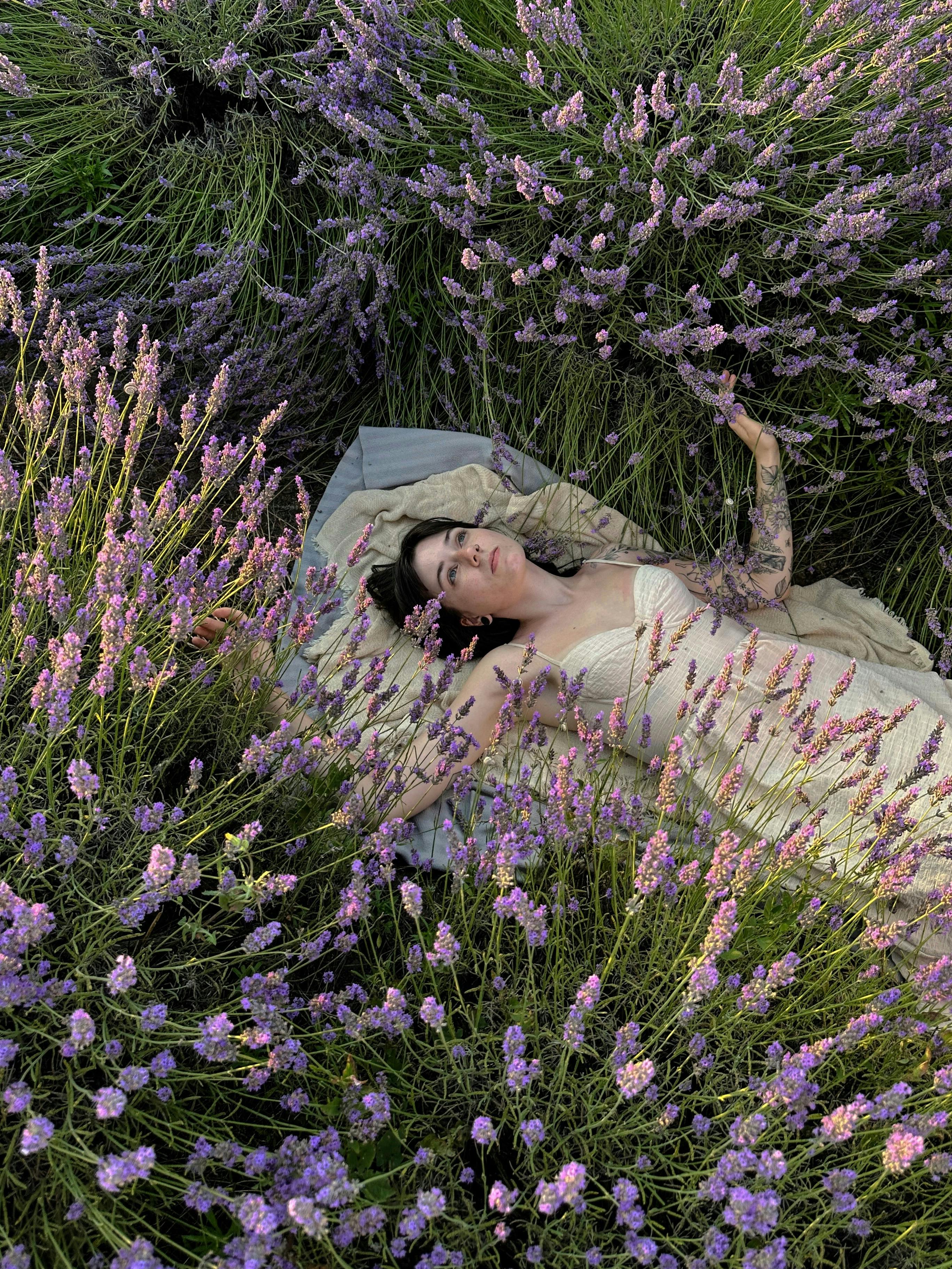 Woman in a lavender field in Serbia, enjoying nature's tranquility.