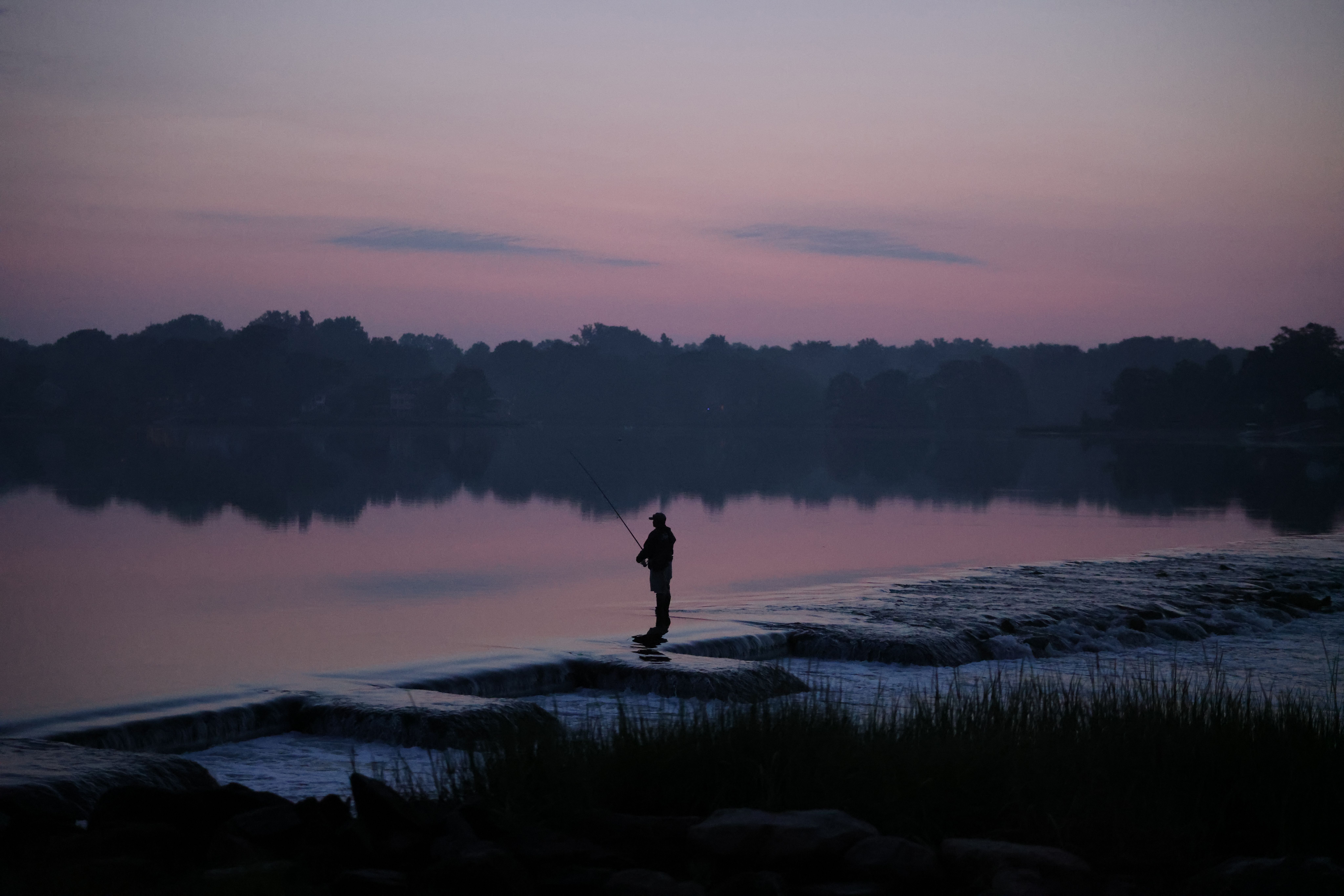 Silhouette of a Man by the Lake · Free Stock Photo
