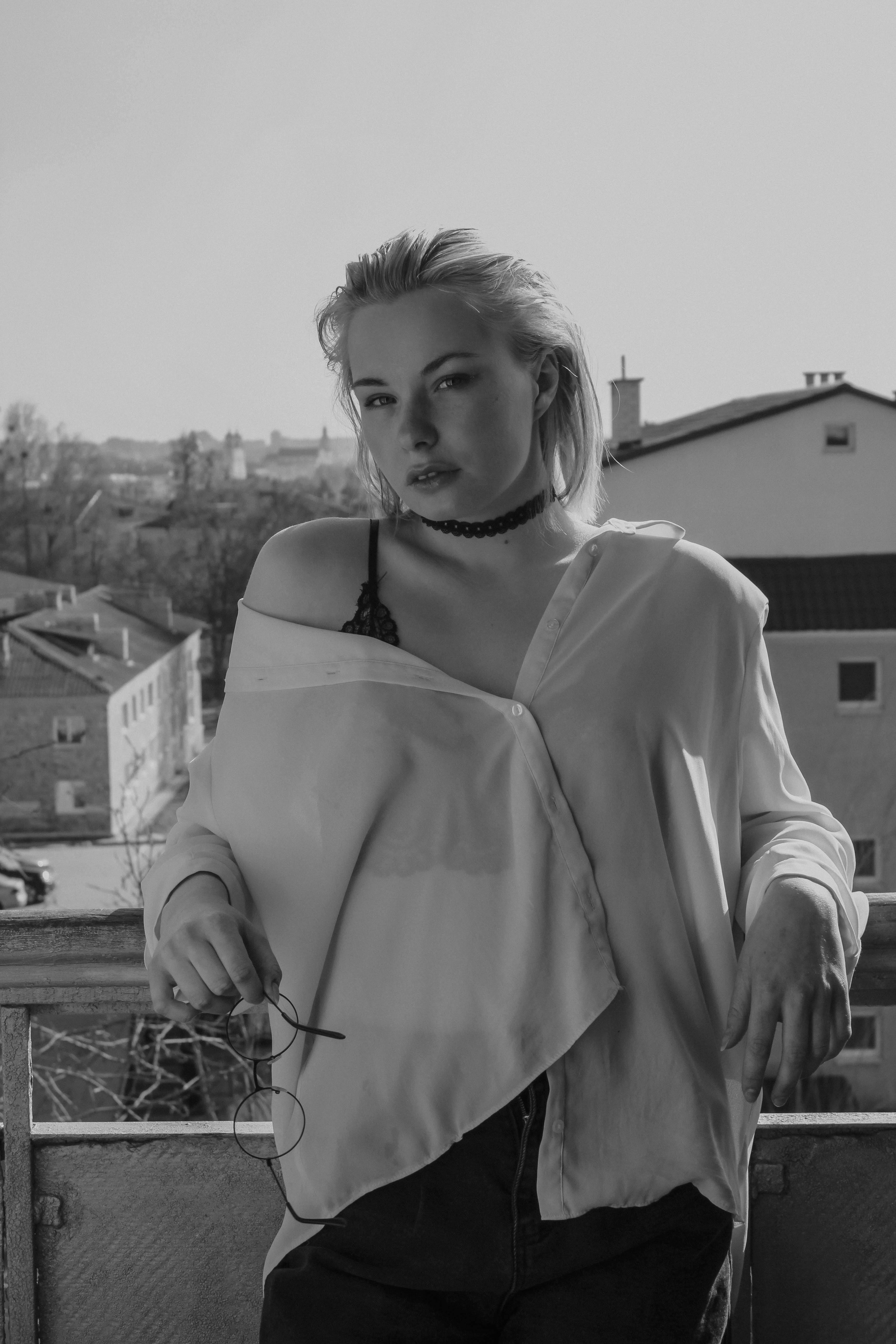 Woman Leaning against Balcony Handrail · Free Stock Photo