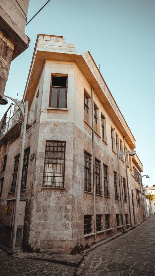 Free Explore the charm of Ottoman architecture in Turkey's old town with this rustic street view. Stock Photo