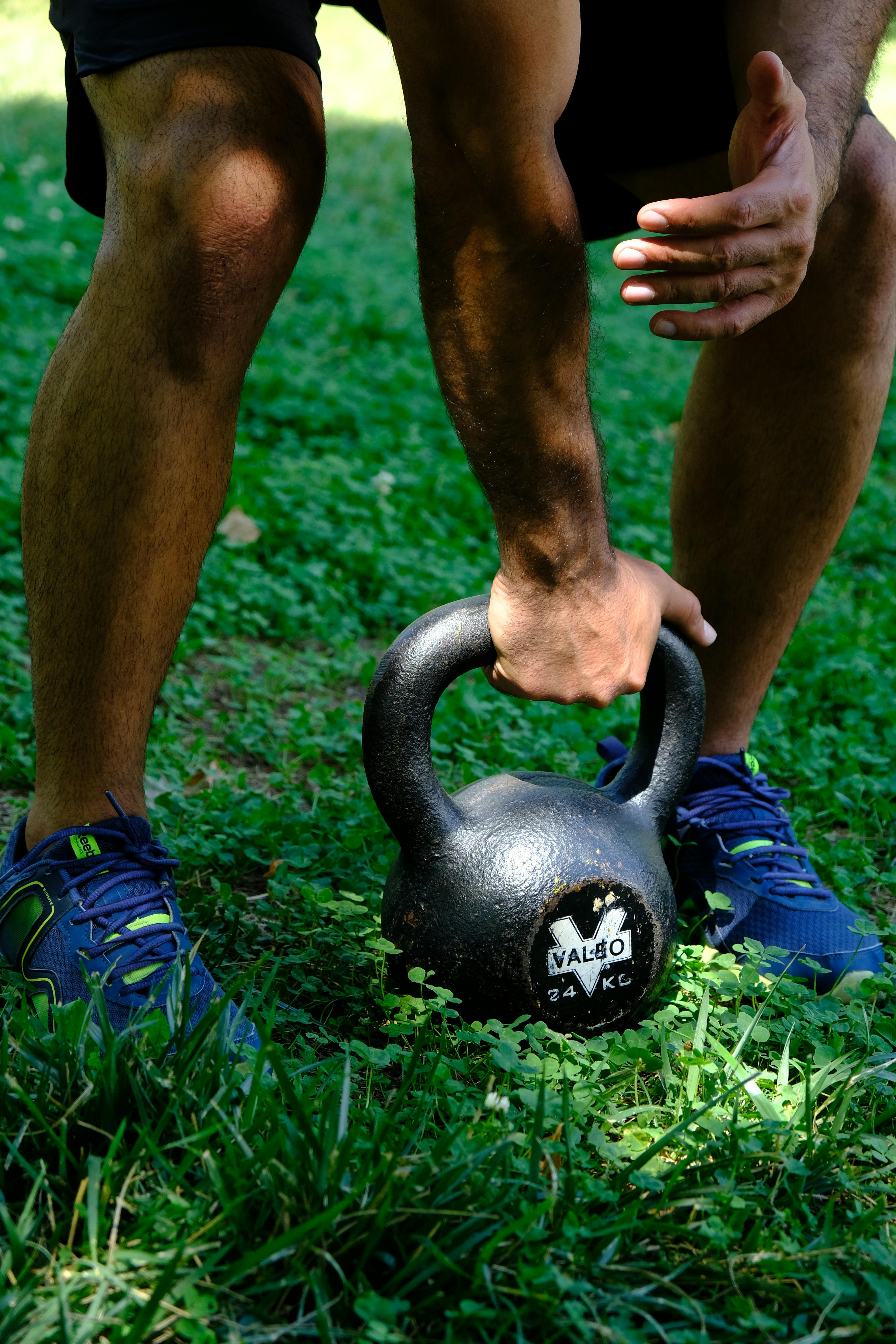 Man Holding Kettlebell in Hand · Free Stock Photo